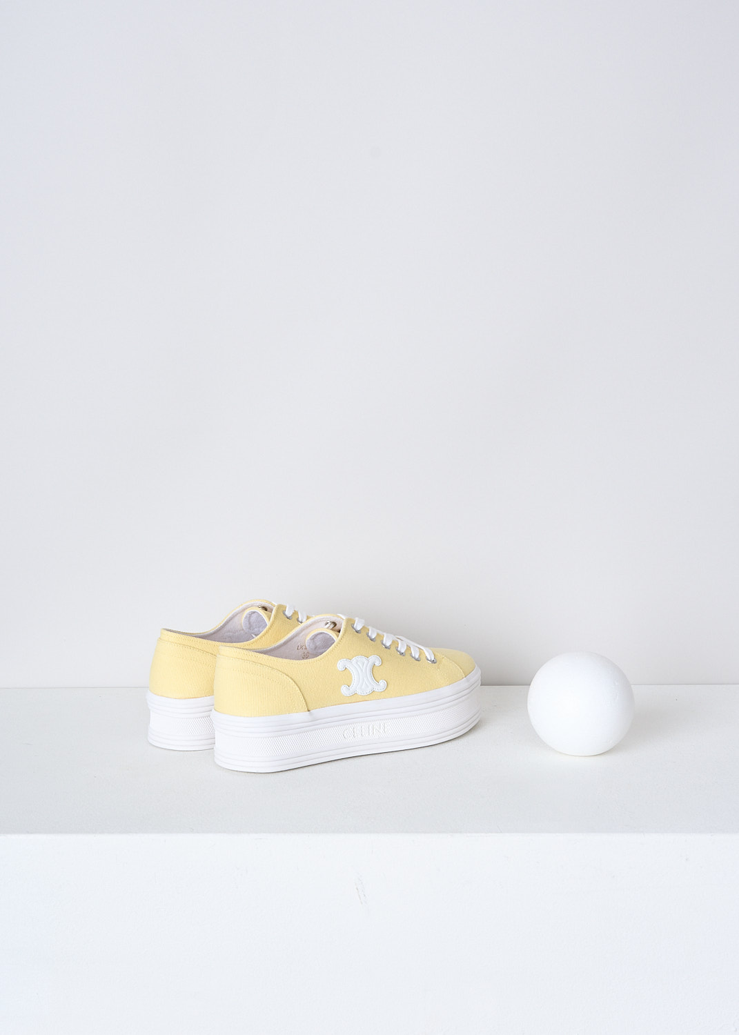 CELINE, BUTTER YELLOW CANVAS JANE SNEAKERS, 346272220C_11LY, Yellow, Back, These butter yellow canvas Jane sneakers feature a front lace-up fastening with white laces. The brand's Triomphe logo patch can be found on the side in white. These sneakers have white platform soles. 
