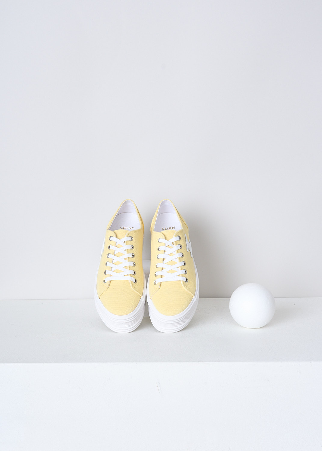 CELINE, BUTTER YELLOW CANVAS JANE SNEAKERS, 346272220C_11LY, Yellow, Top, These butter yellow canvas Jane sneakers feature a front lace-up fastening with white laces. The brand's Triomphe logo patch can be found on the side in white. These sneakers have white platform soles. 
