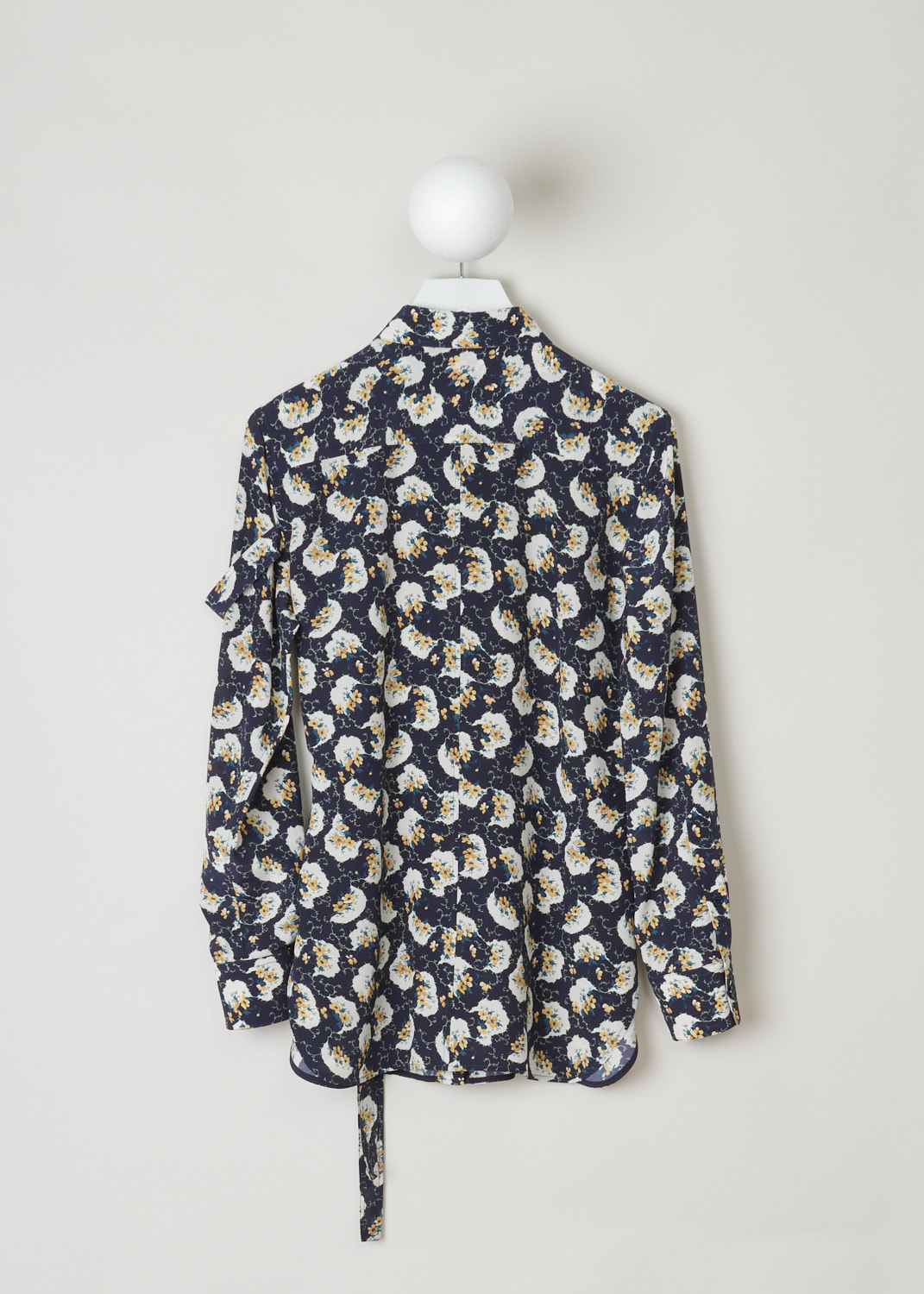 Chloé, Navy blouse decorated with a colorful floral pattern, CHC20SHT40335476_476_dark_night_blue, blue, print, back, A silk crepe blouse adorned with a floral pattern in cream, yellow and green. Featuring a pointed collar which is accompanied by self-tie detail. a similar self-tie feature can be found on waist height and adds more excitement to this blouse. The fastening option here are the concealed buttons on the front.  