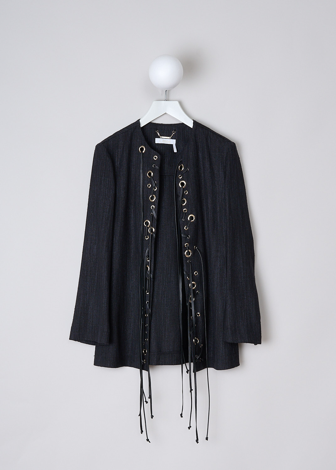 CHLOÉ, BLACK JACKET WITH DECORATED FRONT, CHC22UVE04101001_BLACK, Black, Front, This greyish black open-front jacket has decorative gold-tone rings and long black leather laces on the front. The jackets has long sleeves and a straight hemline. 
