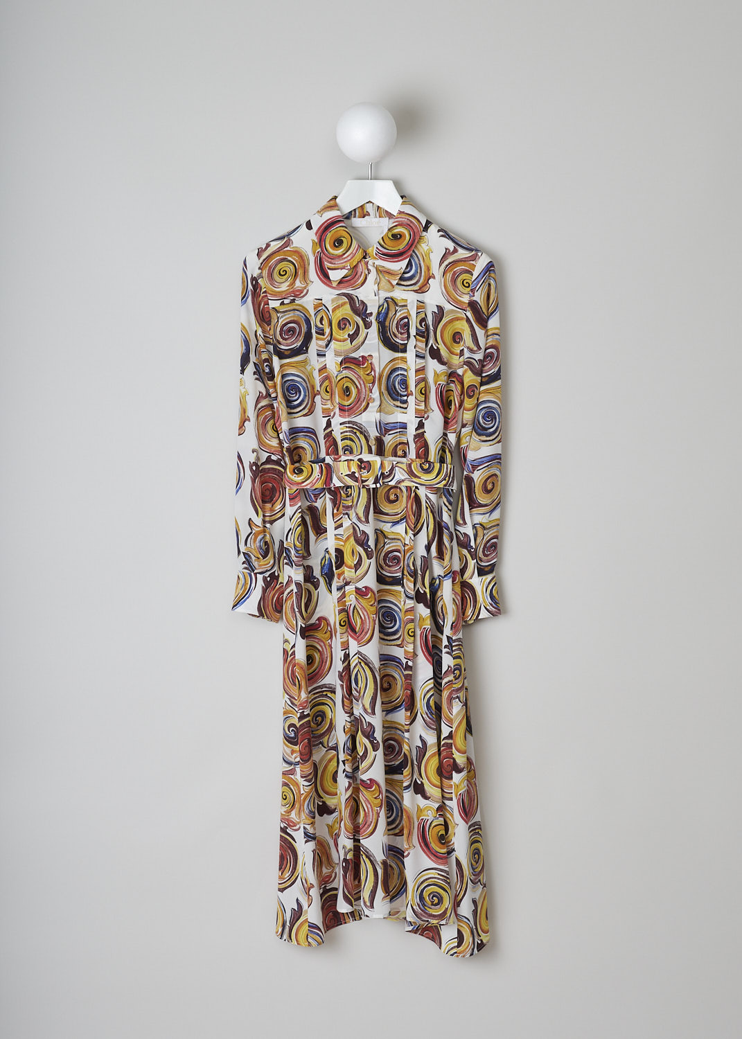 CHLOÃ‰, PRINTED SILK MAXI DRESS, CHC23ARO393039CA_MULTICOLOR_1, Print, White, Pink, Front, This maxi shirt dress has a white base color with an all-over swirl print in shades of yellow, blue, red and orange. The bodice has long sleeves with buttoned cuffs, a spread collar and a front button placket that goes to the waist. A matching fabric belt can be used to cinch in the waist. Knife pleats run along the length of the dress and stop midway on the skirt. A concealed side zip functions as the closure option. 

