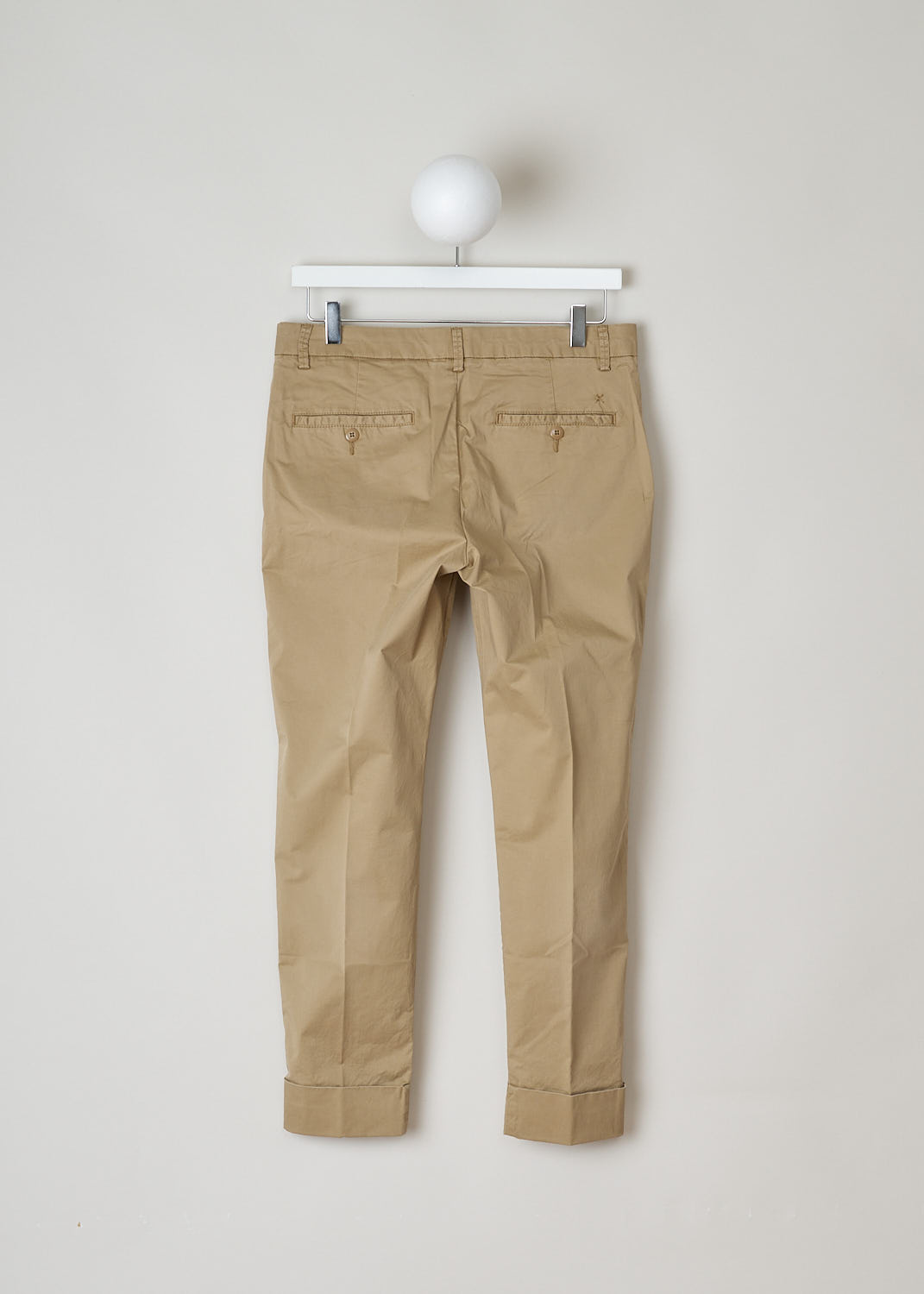 STEWART_C91796_53S_SR_919 CLOSED CLASSIC BEIGE TROUSERS Beige, Back, These classic trousers in beige feature belt loops and a zipper and button closure. They feature slanted pockets on the front and two buttoned welt pockets on the back. What makes this model stand out the is the broad fold-over hem.
 