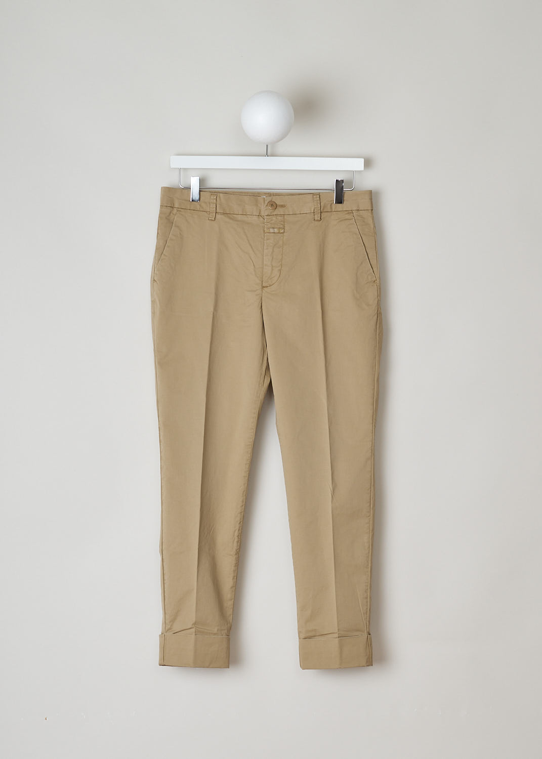 STEWART_C91796_53S_SR_919 CLOSED CLASSIC BEIGE TROUSERS Beige, Front, These classic trousers in beige feature belt loops and a zipper and button closure. They feature slanted pockets on the front and two buttoned welt pockets on the back. What makes this model stand out the is the broad fold-over hem.
 