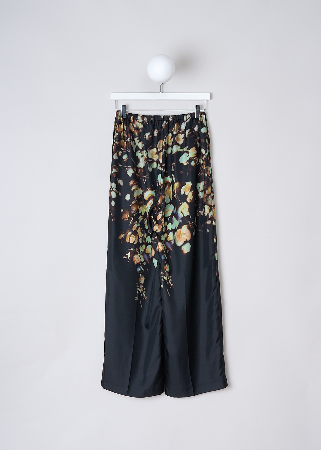 DRIES VAN NOTEN, SILK PUVIS PANTS WITH FLORAL PRINT, PUVIS_LONG_7275_WW_PANTS_PET, Black, Print, Orange, Back, These silk Puvis pants have a black base color with a bleached orange and green floral print. These slip-on pants have an elasticated waistband with drawstring. The loose pant legs have a straight hemline. 