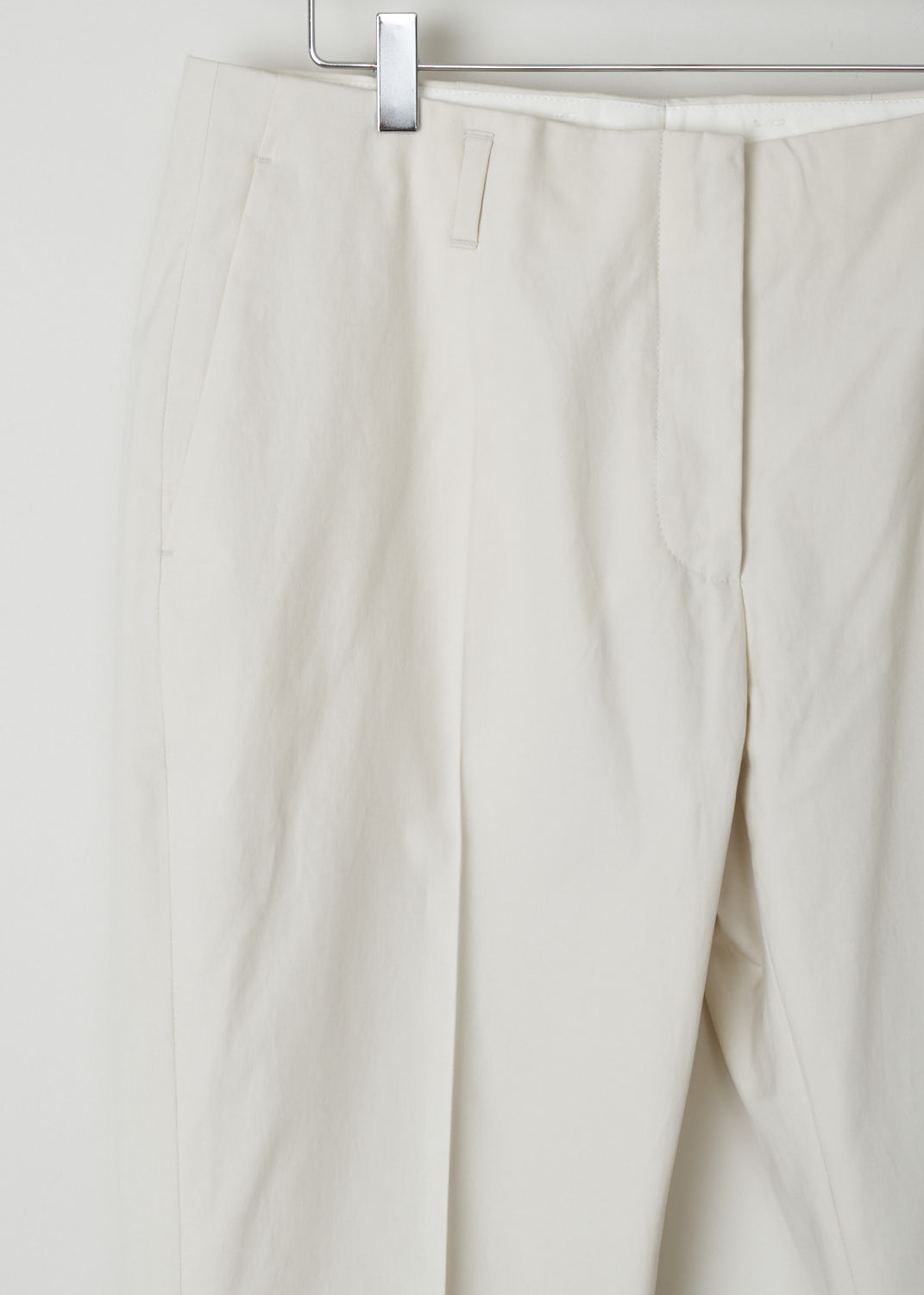 DRIES VAN NOTEN,ECRU PANTS WITH FRONT PLEATS, PAOLA_9022_WW_PANTS_ECR, Beige Detail, These ecru trousers don's have an obvious waistband. Across the waist, belt loops can be found. It comes with a zip and clasp closure. Additionally these trousers have two side slit pockets in the front and two welt pockets in the back. 
