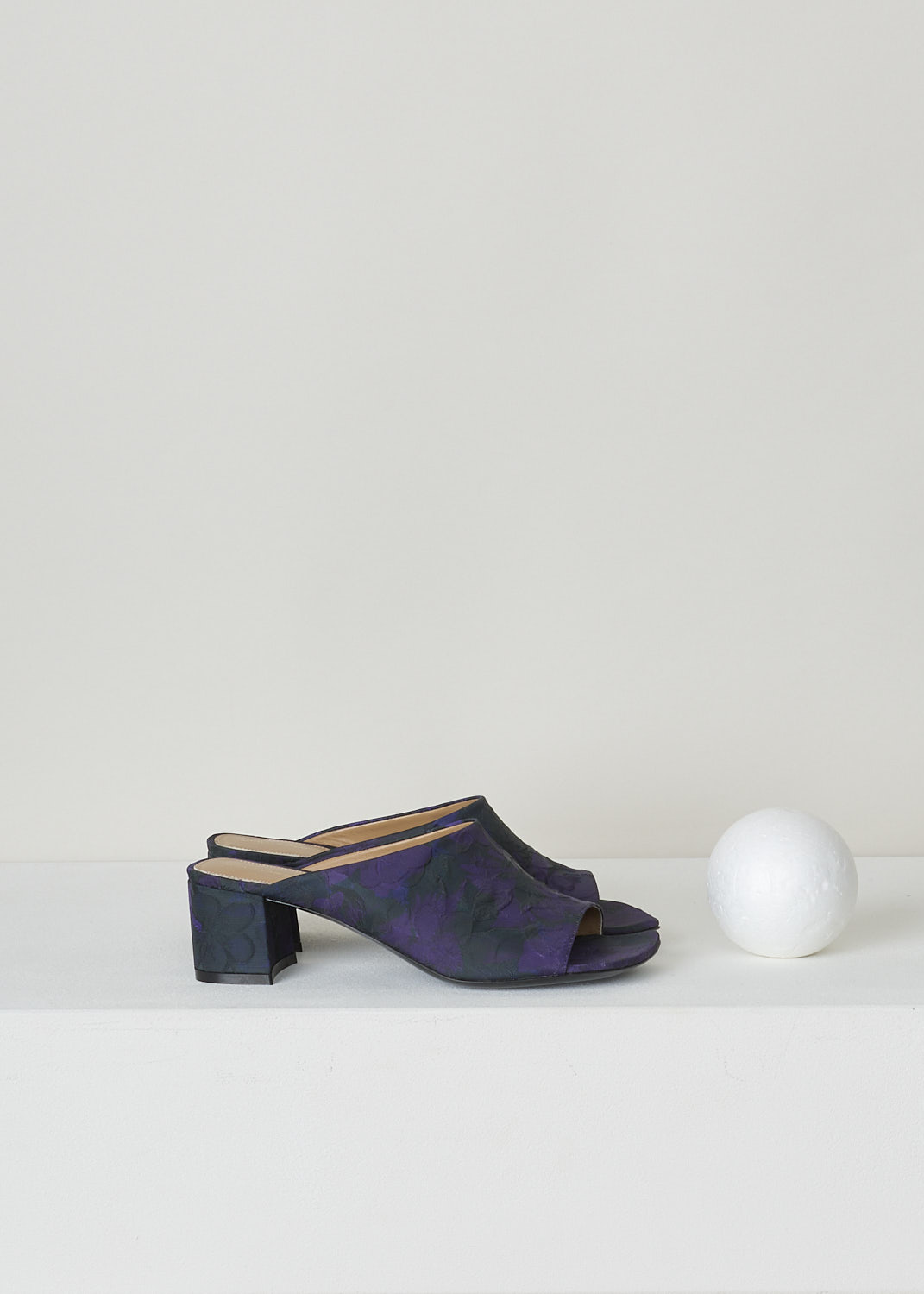 DRIES VAN NOTEN, PURPLE FLORAL MULES WITH BLOCK HEEL, WS231_285_QU704_DES_B976, Print, Purple, Side, These heeled slip-on mules have a dark base with a purple floral print. These mules have a square open-toe front and a block heel. 

