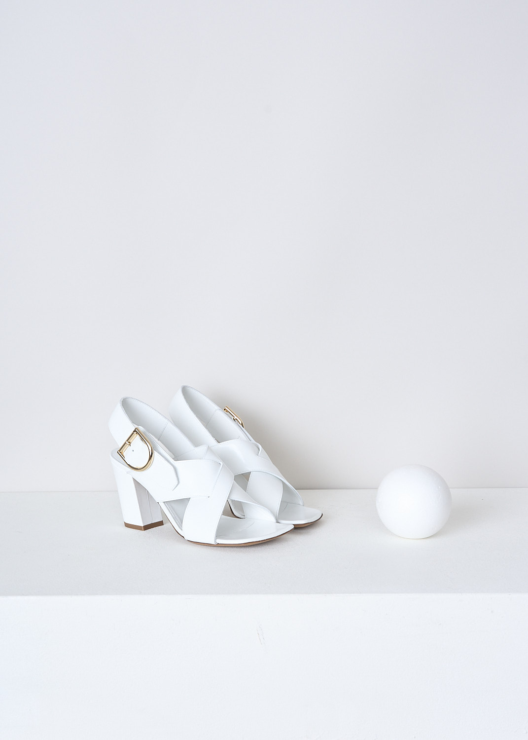 DRIES VAN NOTEN, WHITE HEELED OPEN-TOE SANDALS, WS231_668_QU104_WHITE001, White, Front, These white slingback pumps have an adjustable ankle strap with a gold-tone buckle. These pumps have a crisscross-strap across the vamp with a squared open toe. These pumps have a blocked heel.
