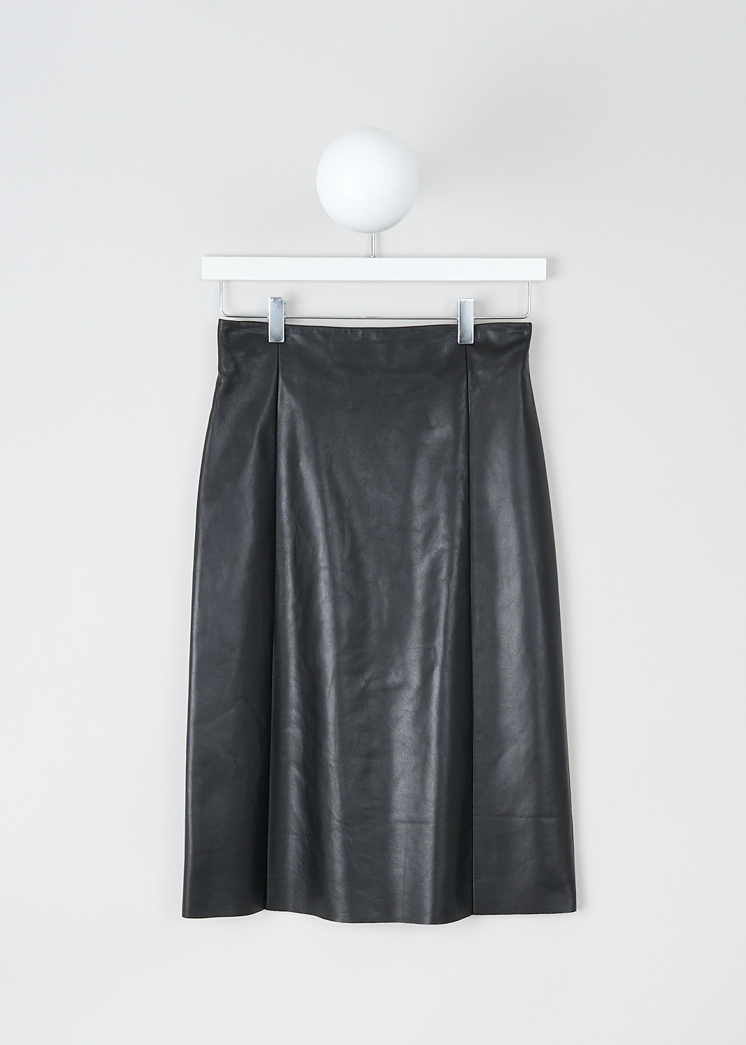 Drome, Black leather midi skirt, DPD1862VP_D1098P_800_BLACK, Black, Front, This black leather midi skirt has a slight A-line silhouette. The skirt has a concealed centre zip in the back. Vertical seam give the skirt a paneled look. The skirt has a straight hemline with a centre vent in the back. The skirt is fully lined.
