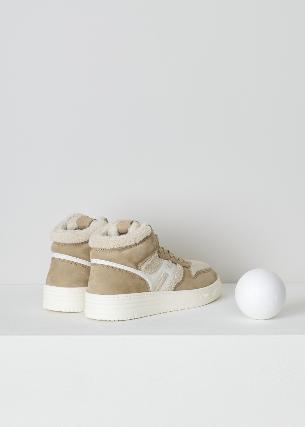 HOGAN, BEIGE TEDDY H630 BASKET SNEAKERS, GYW6300FE30SQW02S1_SQW, Beige, Back, These beige H630 Basket sneakers feature a front lace-up fastening with beige laces. On the tongue, a  brown leather tab has the brand's logo embossed on it. The sneaker consist of brown suede and white teddy fabric. On the side, the brand's H logo has been incorporated in the design in white leather.  These sneakers have a thick white sole. They come with an additional pair of laces in brown.   
