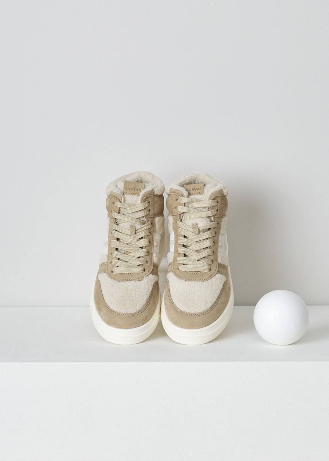 HOGAN, BEIGE TEDDY H630 BASKET SNEAKERS, GYW6300FE30SQW02S1_SQW, Beige, Top, These beige H630 Basket sneakers feature a front lace-up fastening with beige laces. On the tongue, a  brown leather tab has the brand's logo embossed on it. The sneaker consist of brown suede and white teddy fabric. On the side, the brand's H logo has been incorporated in the design in white leather.  These sneakers have a thick white sole. They come with an additional pair of laces in brown.   
