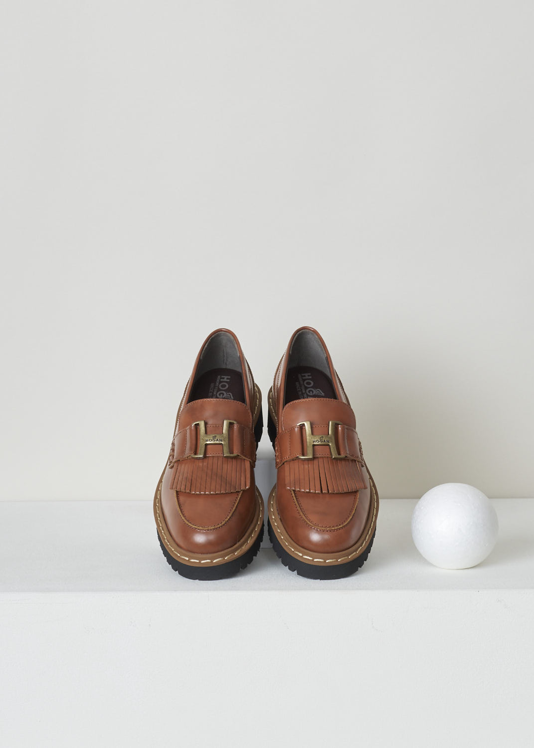 HOGAN, COGNAC MOCASSINS WITH BUCKLE AND TASSELS, HXW5430DH72Q7OS003, Brown, Top,  Cognac colored loafer. These slip-on loafers have a rounded toe with moccasin toe stitching and a H-shaped buckle and tassels over the upper side.

