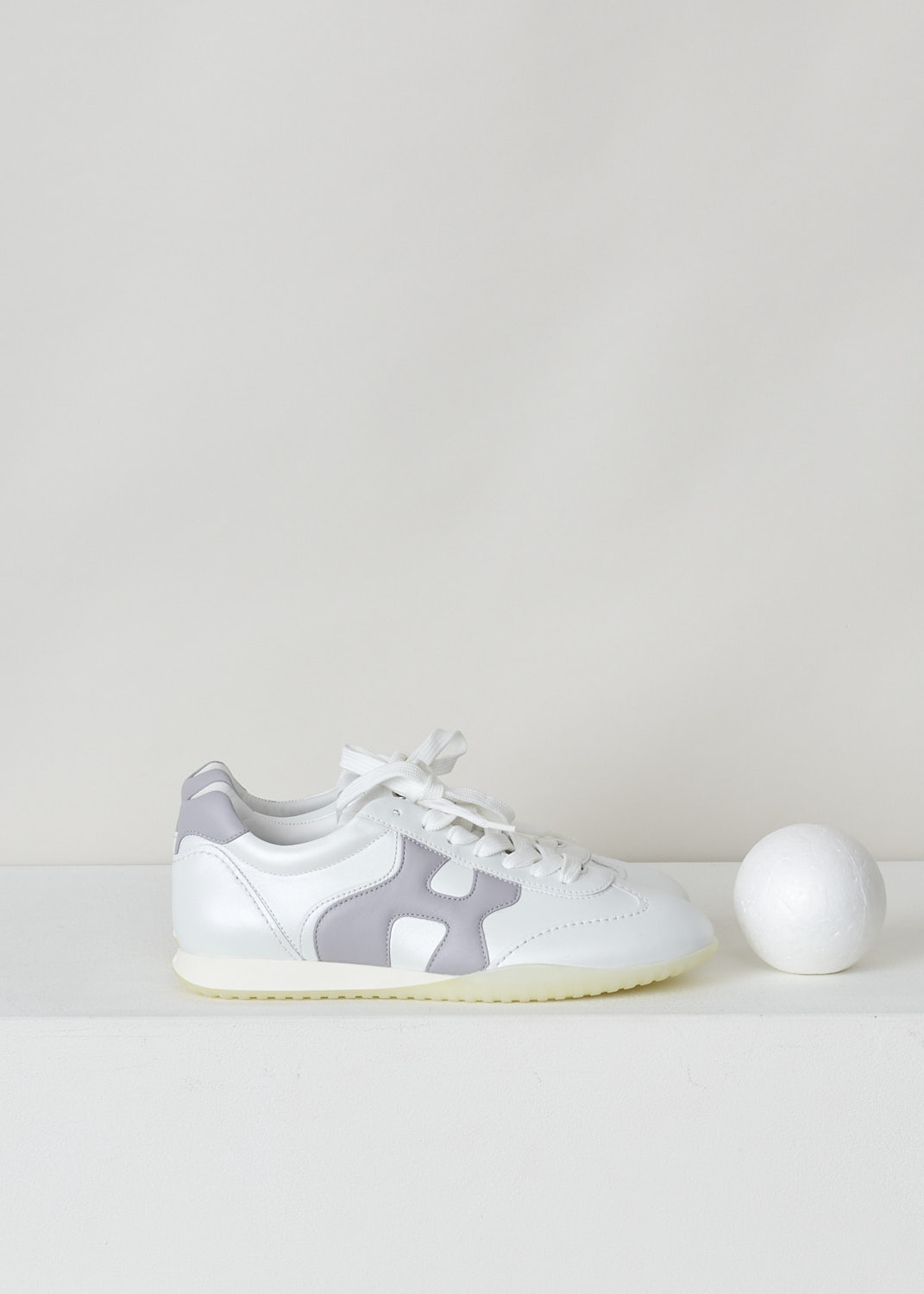 HOGAN, IRIDESCENT WHITE LOW TOP SNEAKERS WITH PURPLE H, HXW5650DO00POX0RAY_OLIMPIA_X_ALLACCIATO, White, Purple, Side, These iridescent white low top sneakers feature front lace-up fastening with white laces and the brand's H logo on the sides in a contrasting purple color. The heel tab is the same purple color. 


