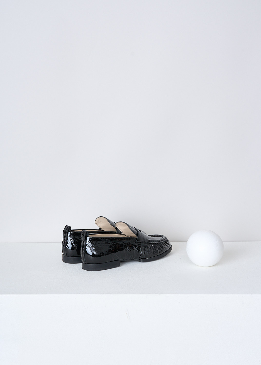 TODS, BLACK LACQUER LOAFERS, XXW02E0EC60QWIB99, Black, Back, These black lacquer slip-on penny loafers have a rounded toe and a decorative slotted leather strip over the upper side. Around the trim, the leather is subtly pleated. These loafers have black soles.
