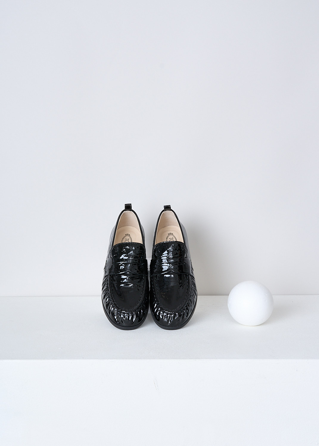 TODS, BLACK LACQUER LOAFERS, XXW02E0EC60QWIB99, Black, Top, These black lacquer slip-on penny loafers have a rounded toe and a decorative slotted leather strip over the upper side. Around the trim, the leather is subtly pleated. These loafers have black soles.
