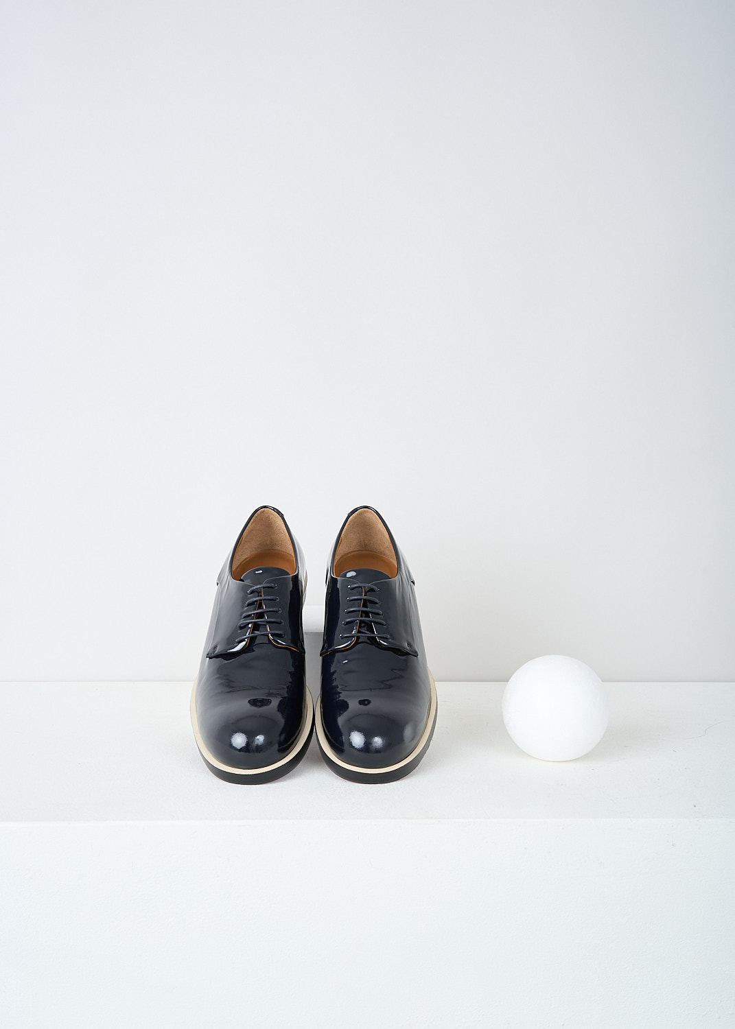 Jil Sander, Patent black leather lace-up shoes, JS23018_746_NOTTE_GUARDOLO_ICE, Black, Top, These patent black leather derby shoes have a classic lace-up closing. The top peeking out of the otherwise black soles creates a white trim along the shoes. 
