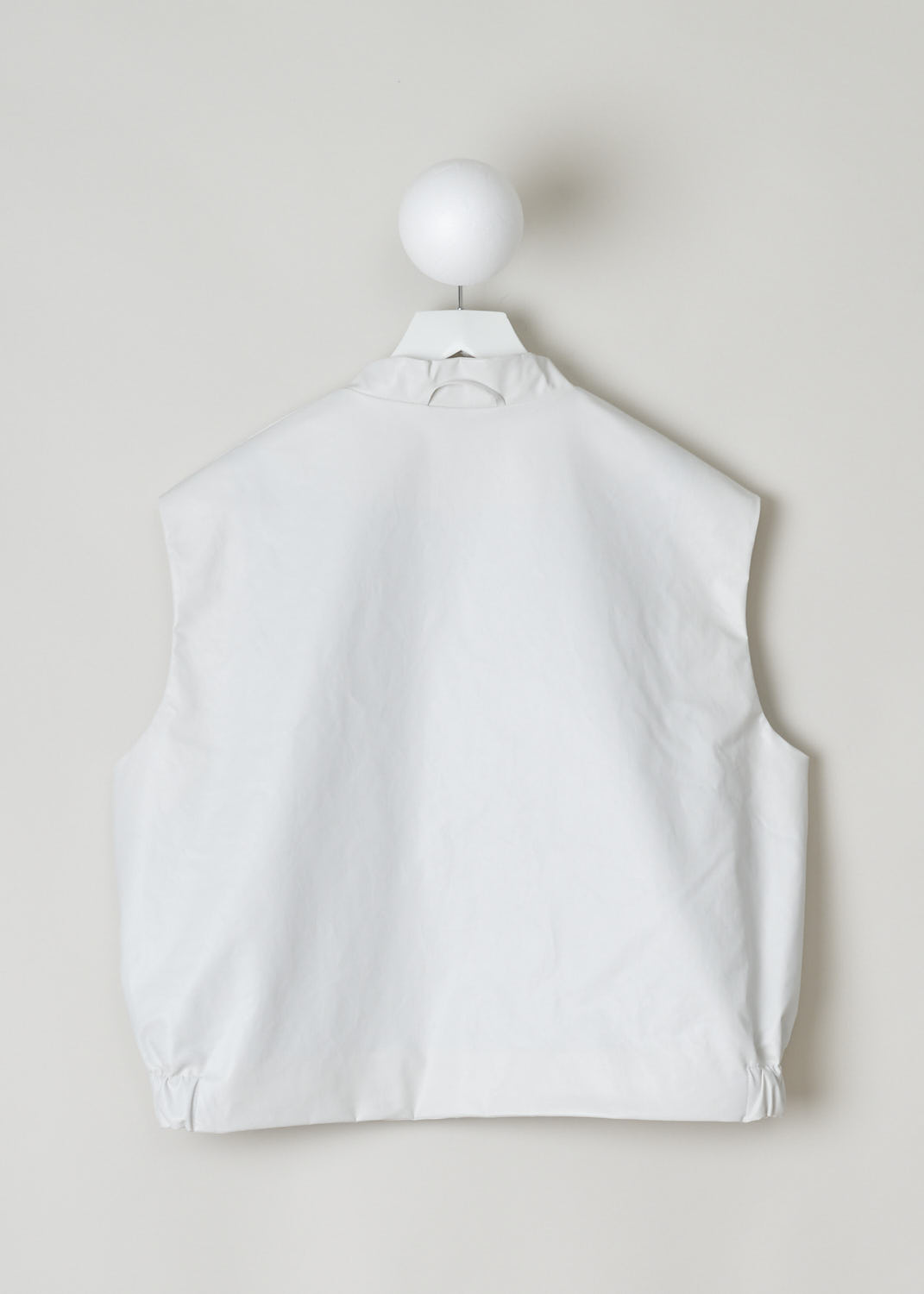 KASSL, SLEEVELESS BOMBER IN OFF WHITE, C212100000W, White, Back, This white sleeveless bomber features a front press button closure, a V-neckline and a gathered, elasticated waistline.  The bomber has two welt pockets with press button in the front and has two inner pockets. In the back of the neck a little loop can be found with which you can hang this garment. 
