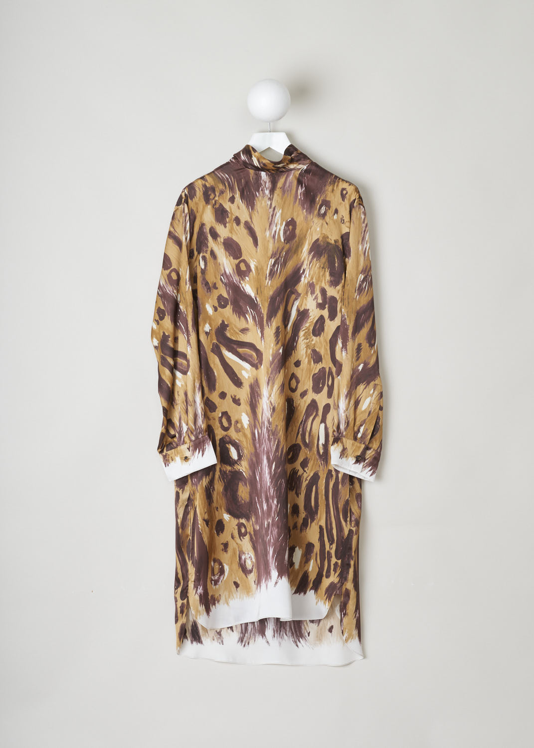 MARNI, ANIMAL PRINT SHIFT DRESS WITH SELF-TIE DETAIL, ABMA0859O0_UTV912_WBM20, Print, Brown, Front, This loose fitting midi dress is made in a satin animal print. Most noteworthy is the self-tie detail, with the ends draping along the back. The long sleeves had cuffed ends. The model has an asymmetrical finish, meaning the back is a little longer than the front. On either side, rounded slits can be found. Three buttons in the back function as the closure option.
