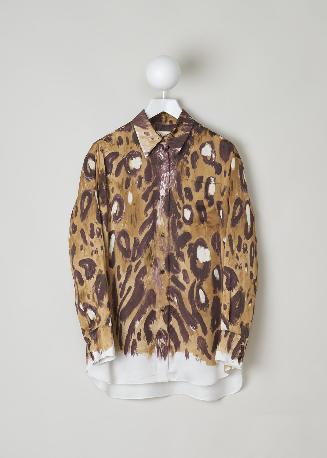 MARNI, ANIMAL PRINT BLOUSE WITH LONG SLEEVES, CAMA0490A0_UTV912_WBM20, Print, Brown, Front, This long sleeved blouse is made in a satin animal print. This blouse features a classic collar, a single breast pocket and front button fastening. This model has an asymmetrical finish, meaning the back is a little longer than the front.


