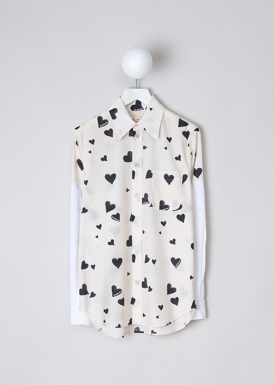 MARNI, BUNCH OF HEARTS POPLIN BLOUSE, CAMA0544QS_UTC280_BHW03, Black, White, Print, Front, This Bunch of Hearts poplin blouse in stone white has an all-over heart print. The blouse has a spread collar, a front button closure and a single breast pocket. The long crisp white sleeves have buttoned cuffs. The brand's logo is embroidered in black on the back of the neck. The rounded hemline has an asymmetric finish, with the back being slightly longer than the back. 
