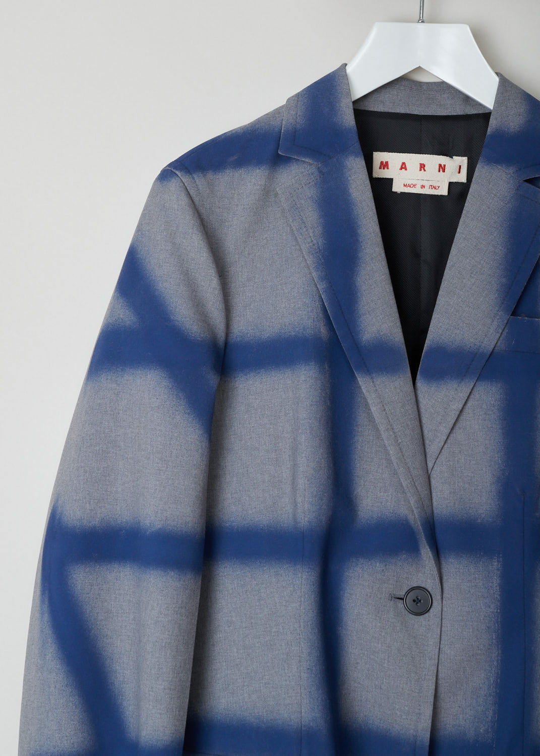 Marni, Checkered overcoat in grey and blue, CPMA0145U6_USCR90_SCB65, blue grey, detail, Knee-long overcoat featuring a blue checkered design on a grey background. The collar that leads into the notched lapel, going further down you will find a single buttoned fastening option. Comes long sleeves supporting three buttons. Furthermore the back of this model is left monotone to emphasize the front. Two flap pockets can be found on the front. 
