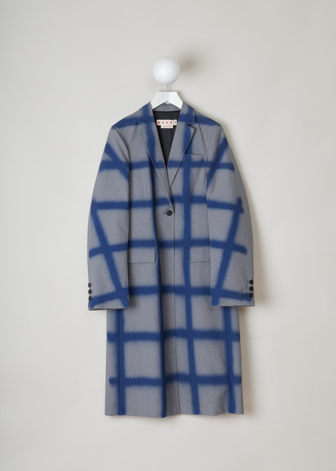 Marni, Checkered overcoat in grey and blue, CPMA0145U6_USCR90_SCB65, blue grey, front, Knee-long overcoat featuring a blue checkered design on a grey background. The collar that leads into the notched lapel, going further down you will find a single buttoned fastening option. Comes long sleeves supporting three buttons. Furthermore the back of this model is left monotone to emphasize the front. Two flap pockets can be found on the front. 