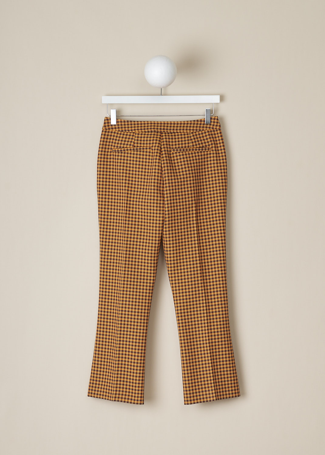 MARNI, ORANGE HOUNDSTOOTH PANTS, PAMA0341IM_UTP730_CHR79, Orange, Print, Back, These mid-rise orange Houndstooth pants has a narrow waistband and a concealed clasp and zip closure. These pants have slanted pockets in the front and welt pockets in the back. Black piping runs along the side seams and centre creases run along the length of the pant legs. 
