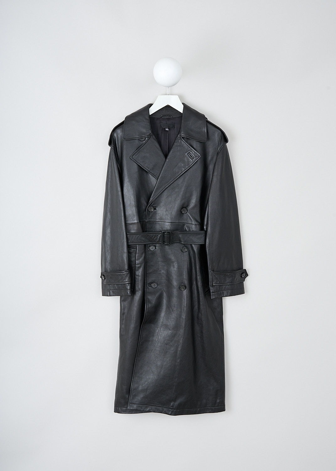 Nili Lotan, Peter oversized leather trench, PETER_OVERSIZED_LEATHER_TRENCH_12369_L115_BLK, Black, Front, This Peter oversized leather trench has a notched lapel and a double-breasted front button closure. The coat has epaulettes on the shoulders. The long sleeves have cuff straps. The coat has a belted waist, slanted pockets and a single inner pocket.
