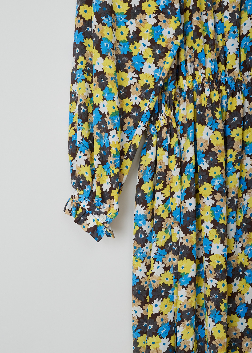 PLAN C, CRÊPE DE CHINE DAISY BOUQUET MIDI DRESS, ABCAD51K00_TS011_FIY04, Yellow, Print, Blue, Detail, This long sleeve Crêpe de Chine dress has an all-over Daisy Bouquet print. The dress has a ruched mandarin collar with a partial button placket going down the front. That same ruching can be found on the buttoned cuffs. The dress has an elasticated waistline. The hemline is straight.  
