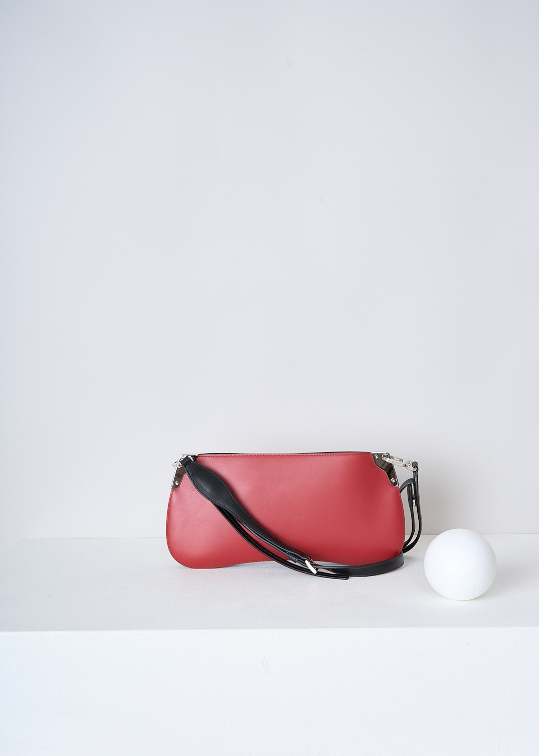 PRADA, BRIGHT RED CROSSBODY BAGUETTE BAG, 2AIX_CITY_CALF_1BH111_F0C9F_FUOCO_NERO, Red, Back, This red leather baguette bag has silver-tone hardware with the brand's lettering on the front in silver-tone metal. The bag has a zip closure that opens up to the main compartment. The compartment has a single slit pocket. The bag has a detachable black leather cross body strap which is adjustable in length. 

