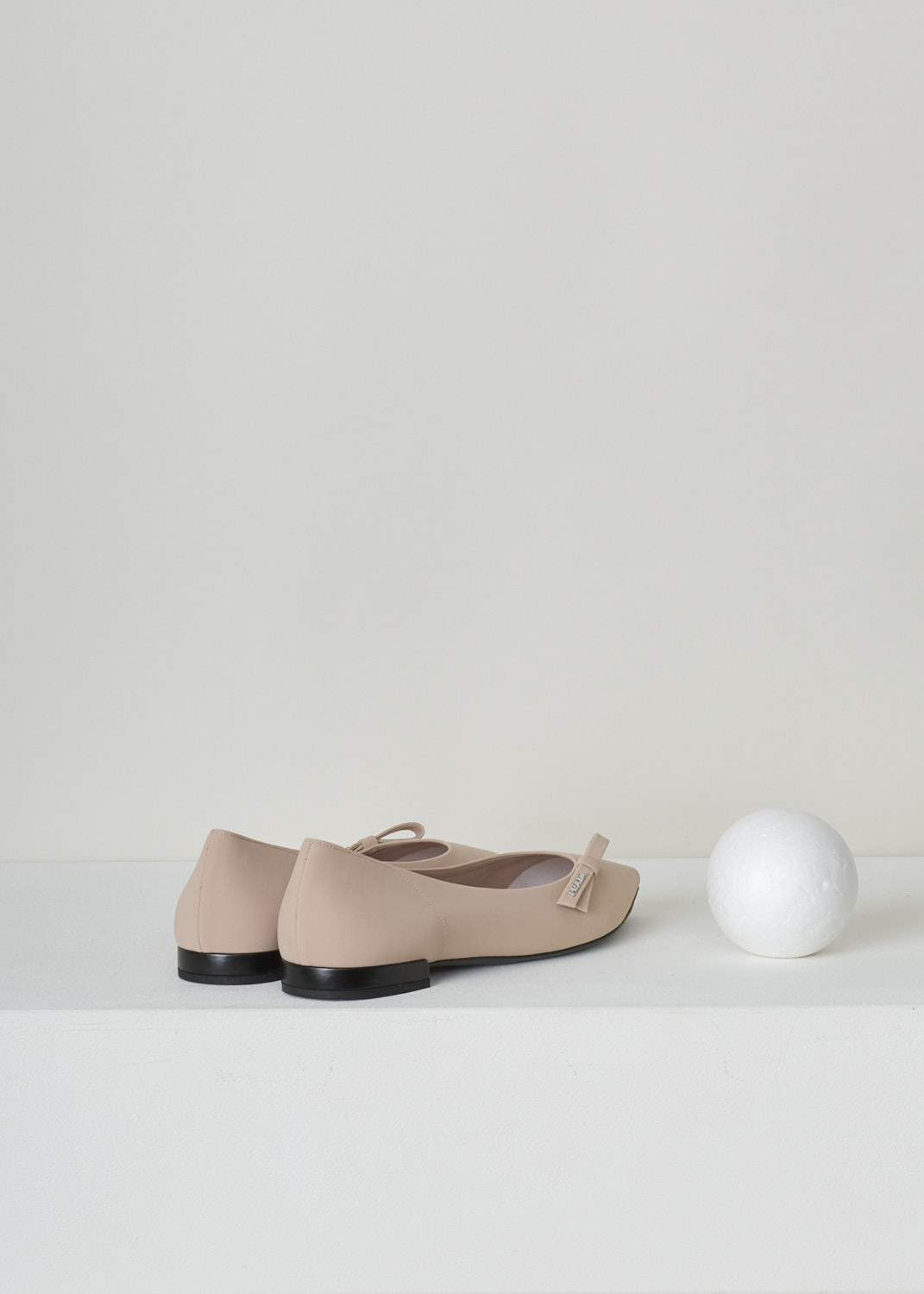 PRADA, NUDE BALLET FLATS WITH POINTED TOE, TESSUTO_TECH_1F273L_3KQ6_F0A48_NUDO, Pink, Beige, Back, These nude colored ballet flats have a pointed toe with, along the topline, a bow with the brand's name in silver-toned letters. These slip-in flats have a small heel. 
