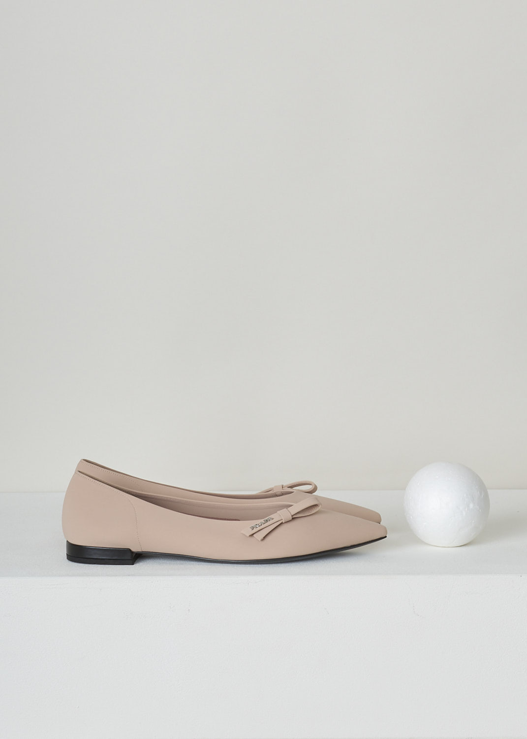 PRADA, NUDE BALLET FLATS WITH POINTED TOE, TESSUTO_TECH_1F273L_3KQ6_F0A48_NUDO, Pink, Beige, Side, These nude colored ballet flats have a pointed toe with, along the topline, a bow with the brand's name in silver-toned letters. These slip-in flats have a small heel. 
