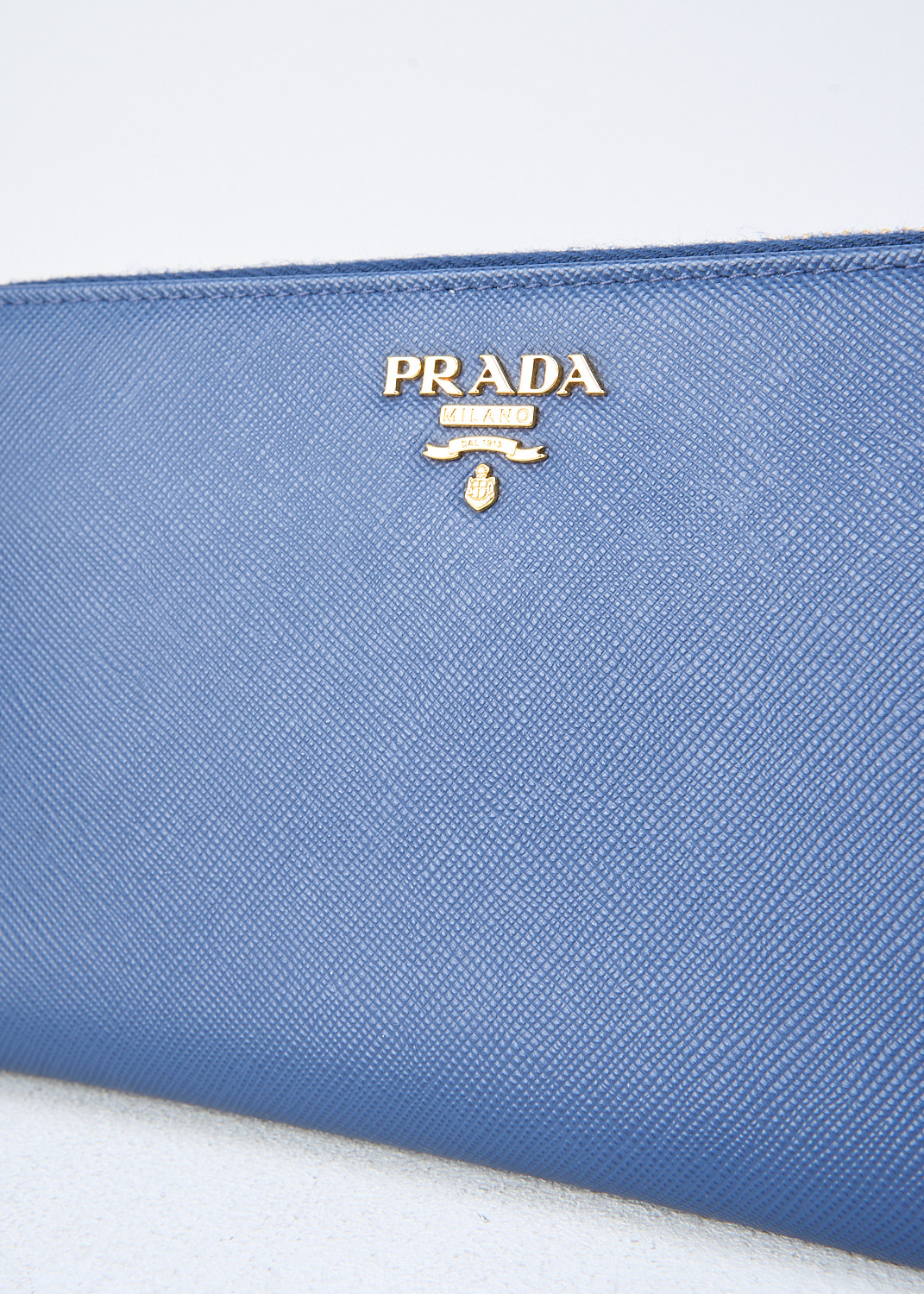 Prada, Blue leather wallet, QWA_SAFFIANO_METAL_1M0506_F0016_BLUETTE_N, Blue, Detail, This blue Saffiano leather wallet has a gold-tone metal logo lettering on the front. The gold-tone zipper opens up to the two bill compartments that are divided by the zipper coin pocket. The wallet has multiple card-slots.