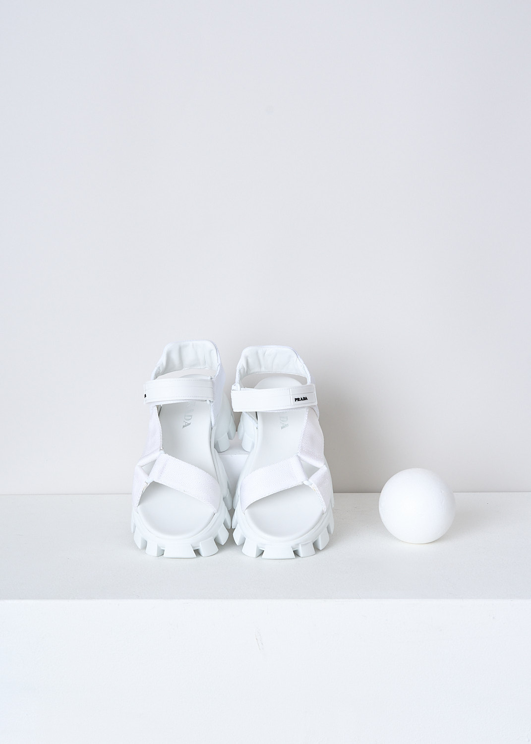 PRADA, WHITE SANDALS WITH CHUNKY SOLES, 1X037M_3L6W_F0009_NASTRO_MAGLIA_BIANCO, White, Top, These white sporty sandals have an adjustable velcro ankle strap with the brand's logo on in in black and white fabric straps across the vamp. These sandals have a round open-toe and chunky ridged soles. 
