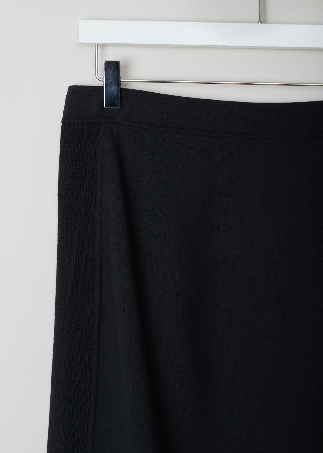 Prada, Straight black skirt with ribbed sides, Lana_double_21H593_F0002_nero, black, detail, Black skirt cut in a straight model made with stretchy materials for that extra bit of added comfort. Featuring ribbed sides and has a concealed zipper as your fastening option. Has a matching blazer 