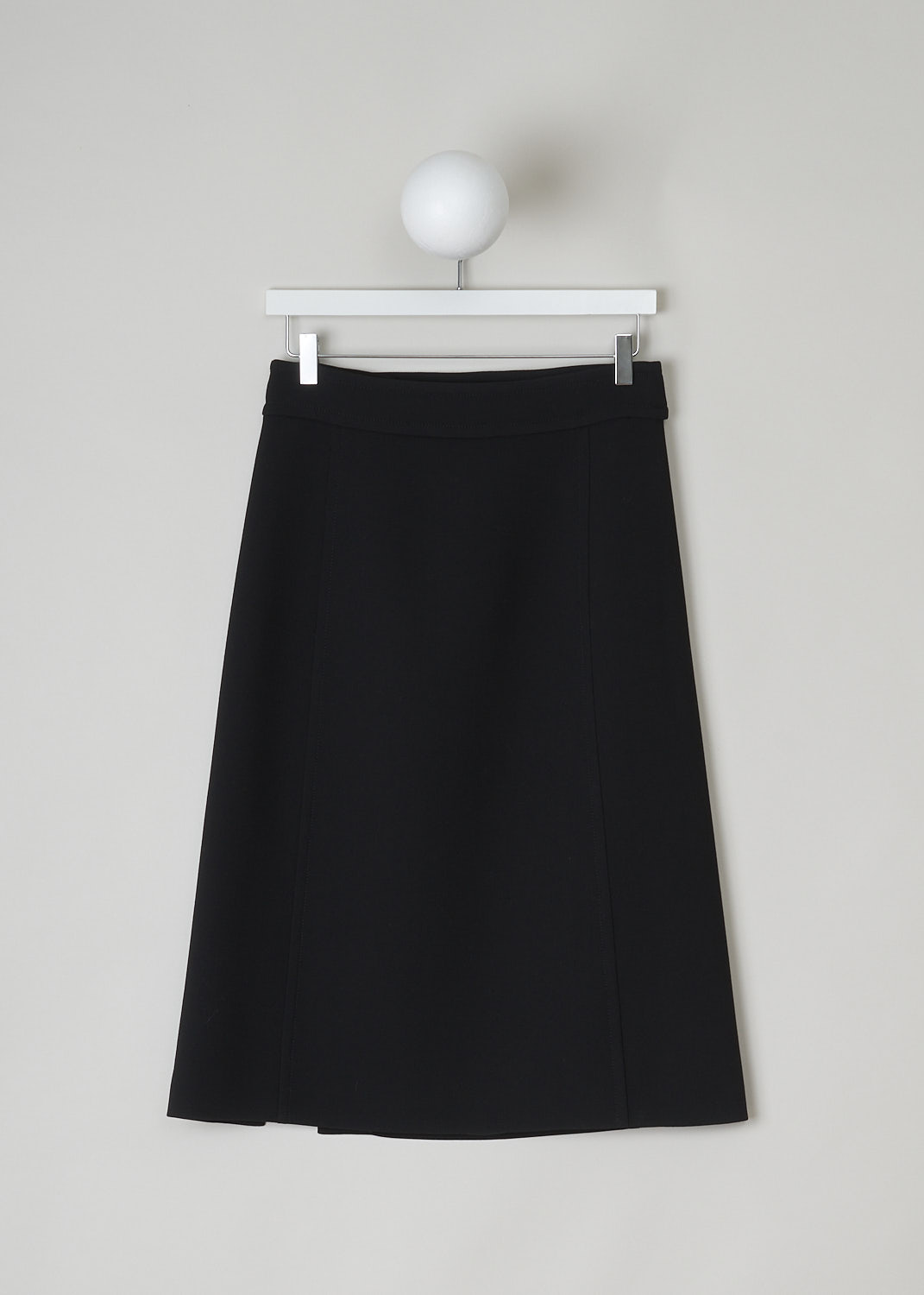 PRADA, BLACK A-LINE MIDI SKIRT, P113H_GUL_F0002_NATTE_GONNA_NERO, Black, Front, This black wool midi skirt has an A-line silhouette. In the back, on the broad waistband, the skirt has an incorporated belted detail with a big round fabric button. Also in the back, the skirt has a side slit and a concealed zipper that functions as the closure option. The skirt is fully lined. 

