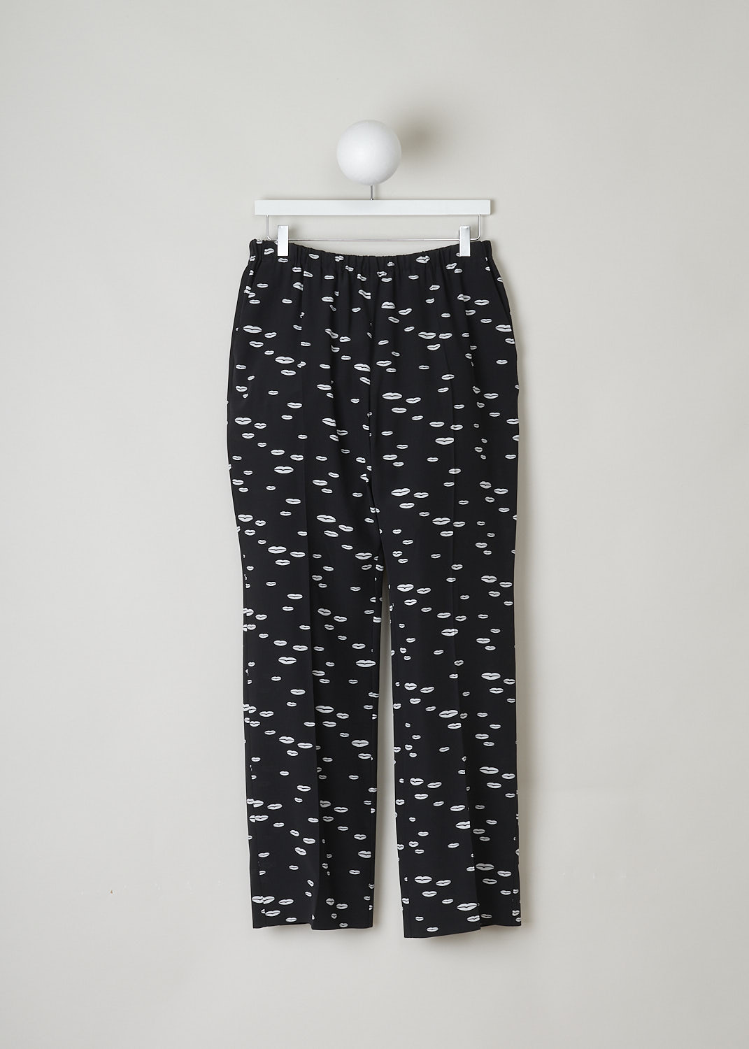 PRADA, BLACK PANTS WITH WHITE LIP PRINT, CDC_BOCCA_P235E_F057Z_NERO_AVORIO, Black, White, Print, Front, These black silk pants have an all-over lip print in white. This slip-on model has an elasticated waistline. These pants have slanted pockets in the front and welt pockets in the back. The straight pant legs have centre creases. 
