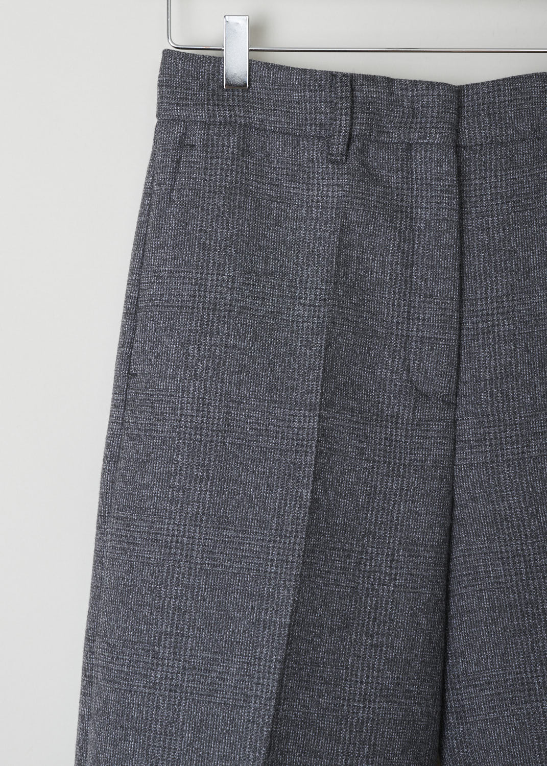 PRADA, GREY TWEED TROUSERS, LJH_GALLES_MOULINE_P293BC_F0480_ARDESIA, Grey, Detail, Sturdy grey tweed trousers. These trousers have belt loops, a clasp and zip fastening, slanted pockets in the front and welt pockets in the back. On the pant legs, centre pleats can be found front and back.
