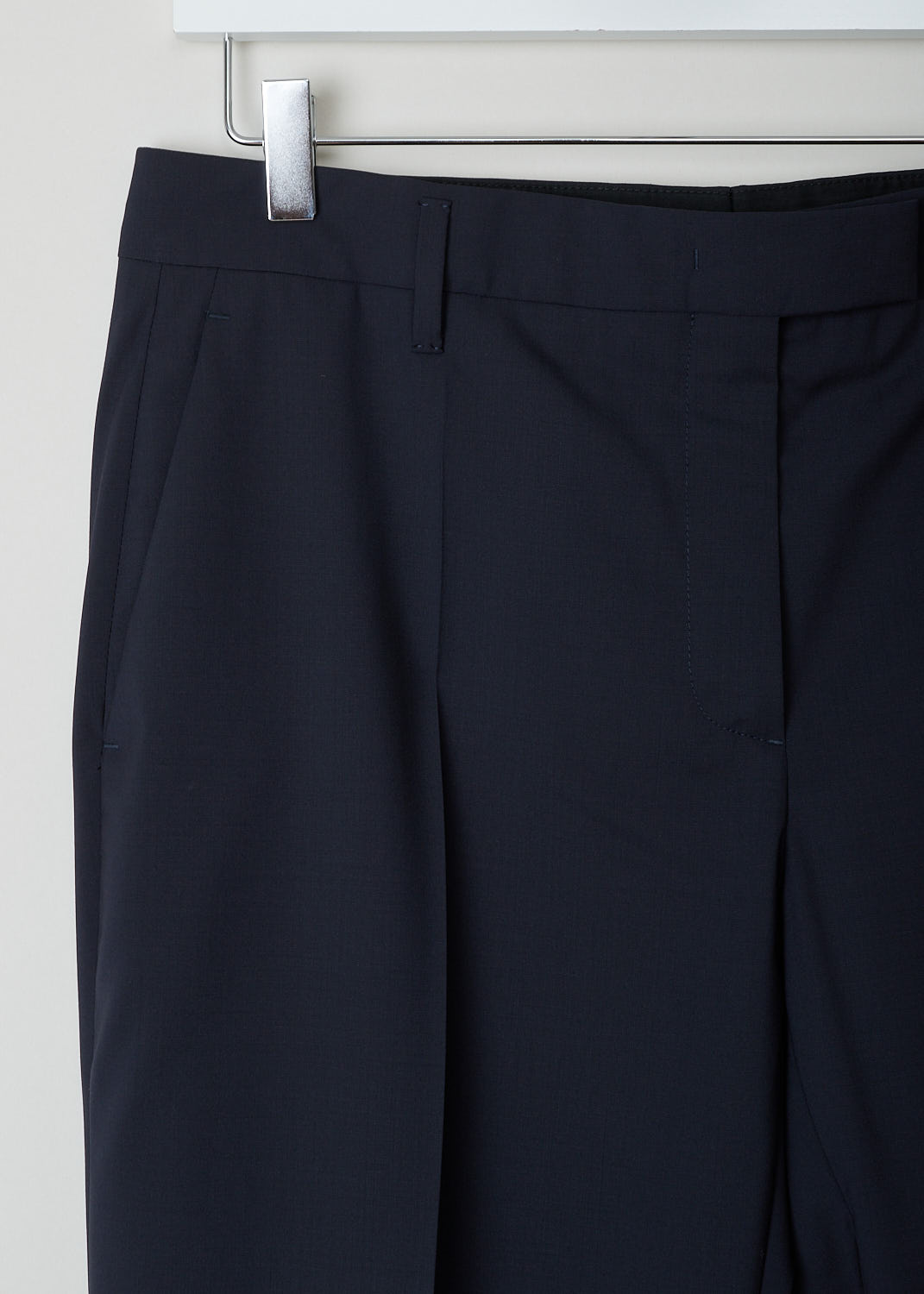 Prada, Classic navy blue pants, LANA_LEGGERA_P296B_BLUE, Blue, Detail, These classic navy blue pants have a concealed zip and double clasp closure. The pant legs have pressed creases. These pants have forward slanted pockets in the front and welt pockets in the back.
