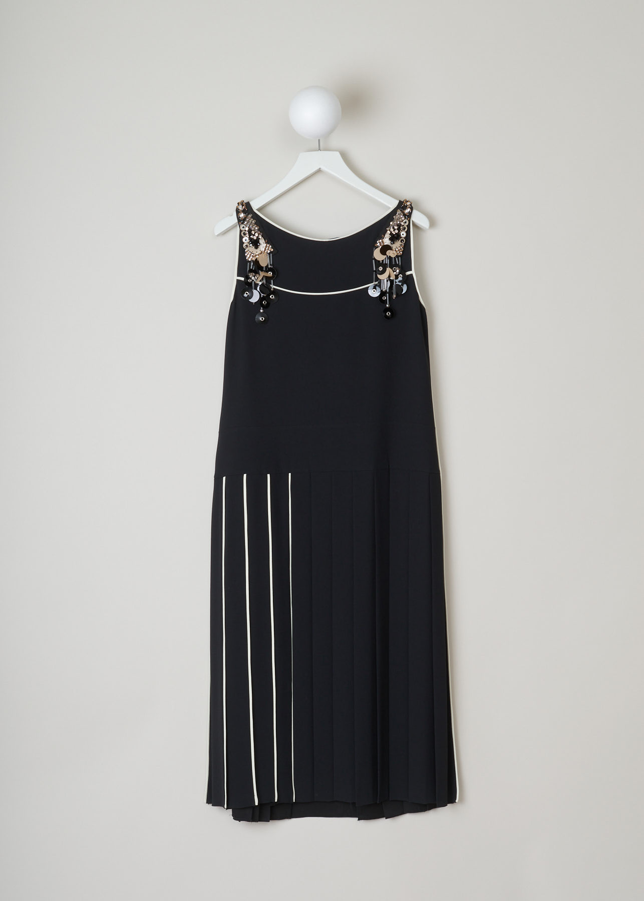 Prada, black beaded and sequined dress, SablePipingR_P33F7R_F0SJ2_NeroAvorioGRI, black, back, black dress trimmed in white. beautiful beads,crystals and sequins on the shoulder. concealed zipper on the left side of the dress. pleated skirt which flares out. 