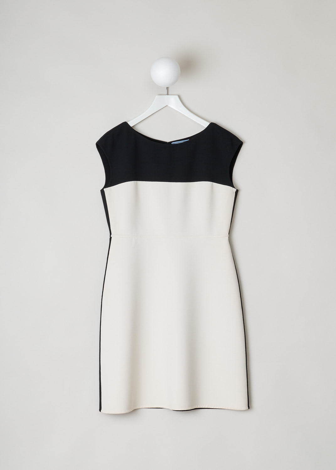 Prada, A-line dress in white with black, natte_double_B_P399T_F0N_nero_talco, black white, front, Midi length black and white A-line dress. Black on the back, and from the chest down white. Featuring a scoop neckline, no sleeves and a concealed zipper on the back. 