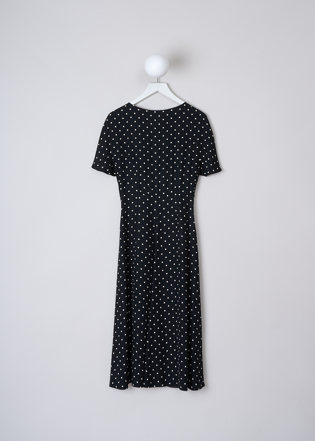 PRADA, BLACK MIDI DRESS WITH WHITE POLKA DOT PRINT, SABLE_POIS_ABITO_P3D14_1YH2_F057Z,  Black, White, Print, Back, This short sleeve midi dress has a black base color with a small white polka dot print. The dress has a V-neckline. In the front, a two-way zip runs down the length of the dress with gathered pleats along the zipper. Below the buste, two ties can be used to cinch in the dress. The dress has a straight hemline.
