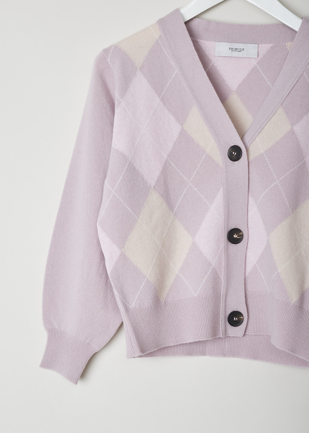 PRINGLE OF SCOTLAND, POWDER PINK ARGYLE CARDIGAN, PWB829_TZB2_POWDER_PIN, Pink, Print, Detail, This powder pink argyle cardigan has a V-shaped neckline and a front button closure. The cuffs and hemline have a ribbed finish. The cardigan has a cropped length. 
