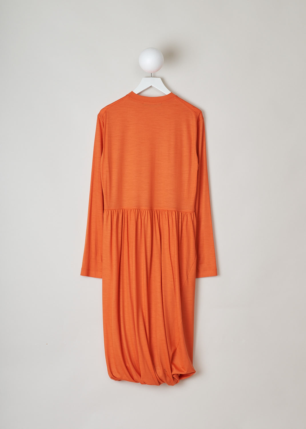SOFIE D’HOORE, ORANGE LONG SLEEVE DRESS, DEMURE_WOJE_PAPAYA, Orange, Back, This orange mid-length dress features a round neckline, a plain long sleeve bodice and a twisted balloon skirt. A single side pocket can be found concealed in the seam. 
