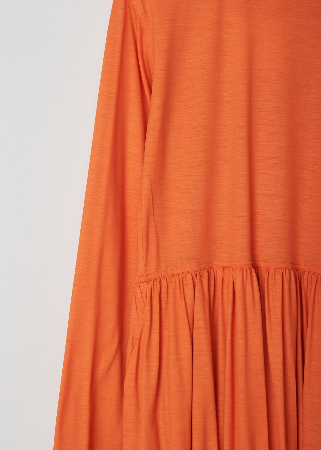 SOFIE Dâ€™HOORE, ORANGE LONG SLEEVE DRESS, DEMURE_WOJE_PAPAYA, Orange, Detail, This orange mid-length dress features a round neckline, a plain long sleeve bodice and a twisted balloon skirt. A single side pocket can be found concealed in the seam. 
