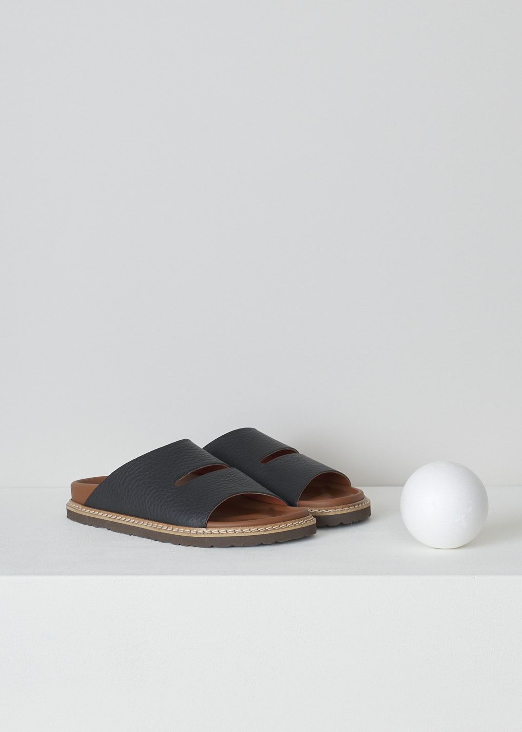 SOFIE Dâ€™HOORE, FABIA SLIP-ON SANDALS IN BLACK, FABIA_LNAT_BLACK, Black, Front, These slip-on sandals in the black have a wide footbed with stitching along the soles. A broad strap with a horizontal cut-out goes across the vamp. These sandals have a round open-toe.
