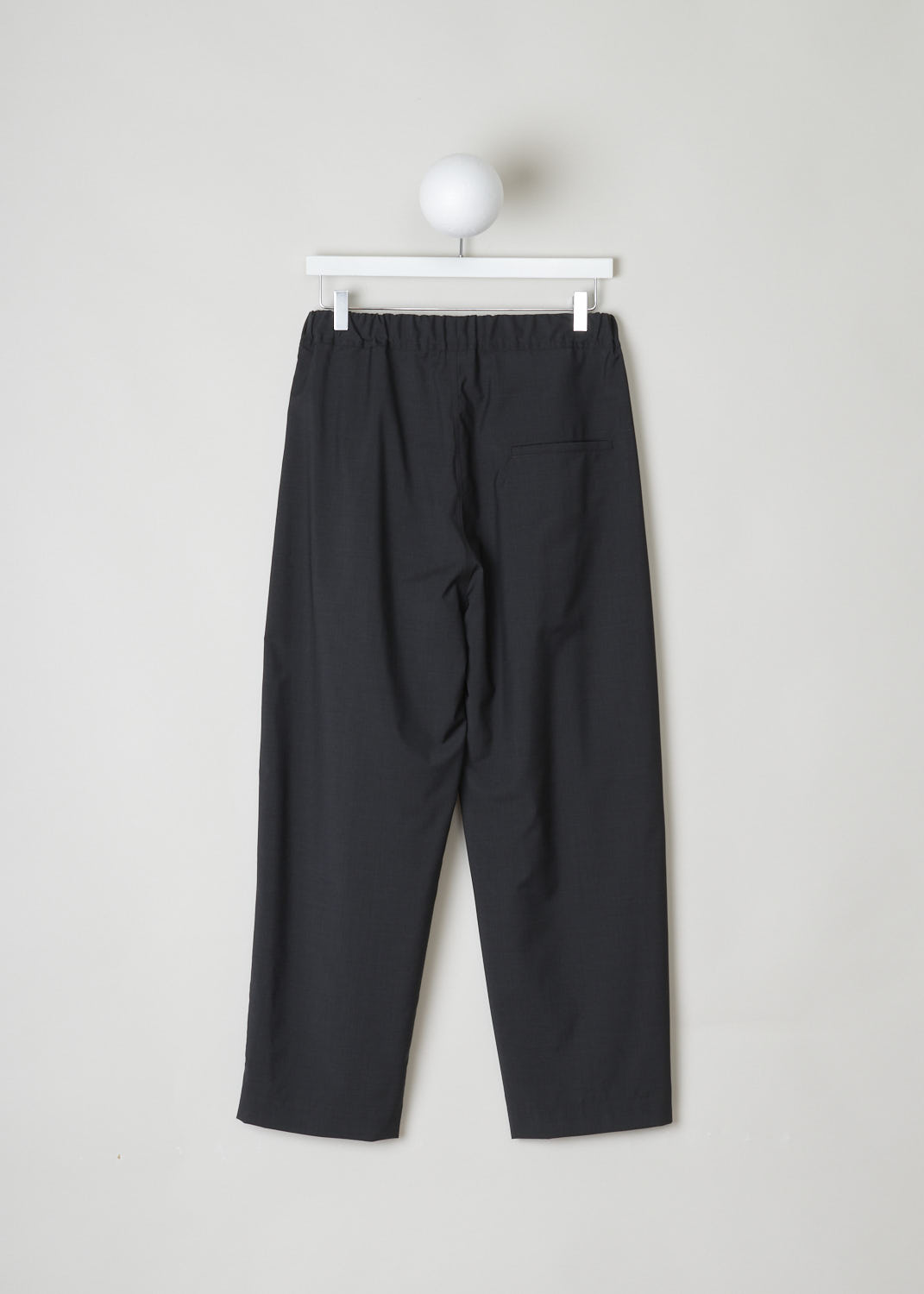 SOFIE Dâ€™HOORE, CHARCOAL PANTS WITH ELASTICATED WAISTBAND, S22_PATIENCE_WOOP_02_CHARCOAL, Grey, Back, These wool, charcoal colored pants have an elastic waistband with a white drawstring on the inside. Slanted pockets can be found on either side. In the back, a single patch pocket can be found. 
