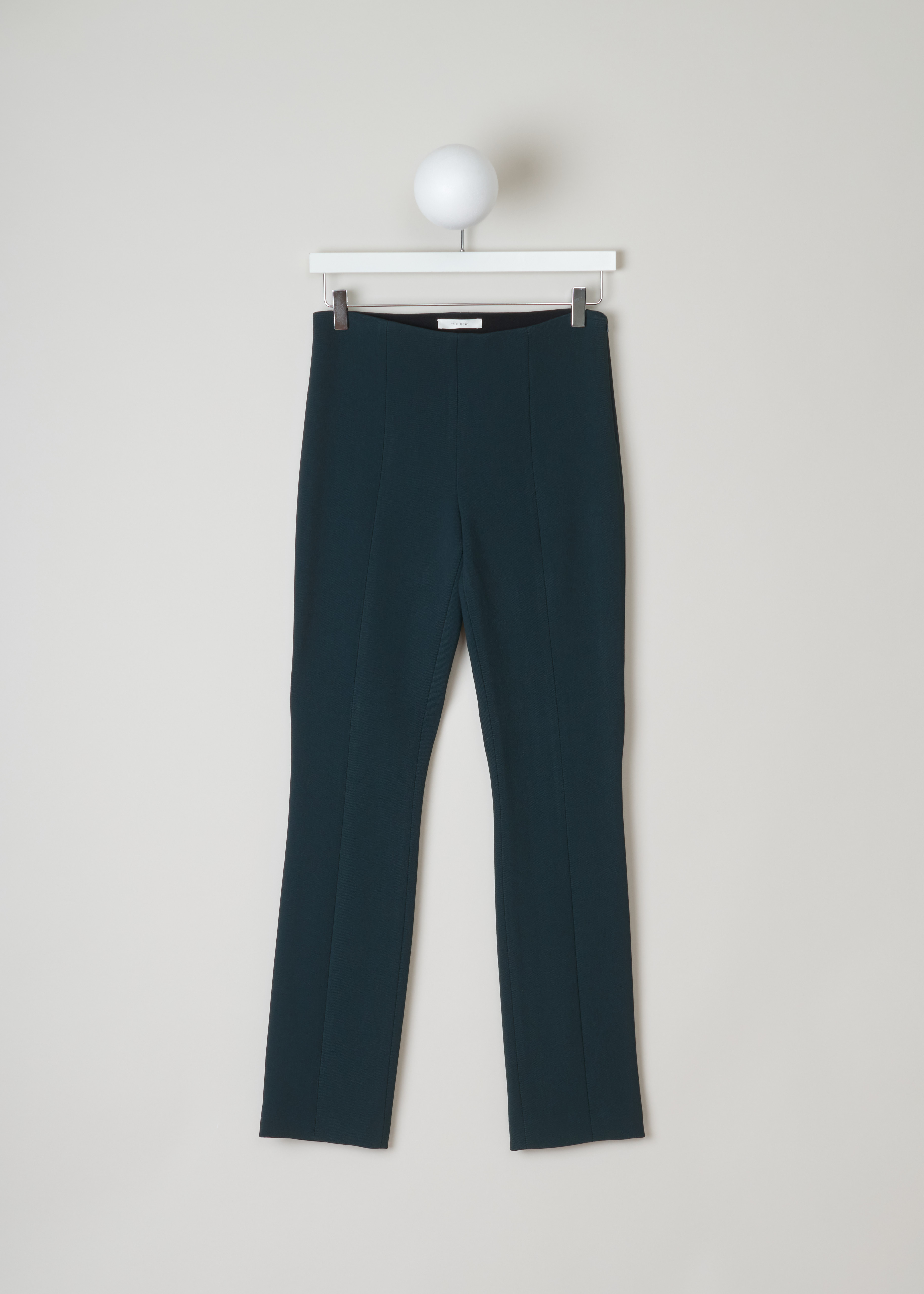 The Row Rona pant in dark green RONA_PANT_4435WI_I_38_DRK_PCCK_GRN front. Straight fitted Rona pant with a high waist, an ankle length and an invisible zipper fastening on the side.