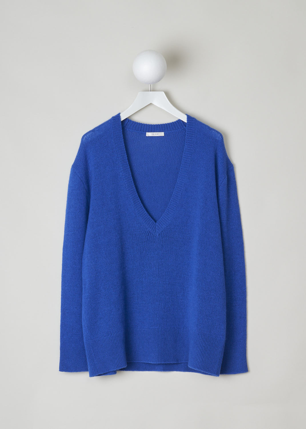 THE ROW, BLUE CASHMERE V-NECKLINE SWEATER, BAUDELIA_TOP_5508YI_87_KLEIN_BLUE, Blue, Front, This blue V-neck sweater is made from a soft blue cashmere. The cuffs, hem and neckline have a ribbed finish. 
