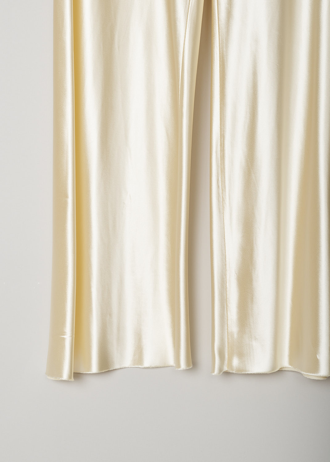 THE ROW, SATIN GALA PANTS IN VANILLA, GALA_PANT_1766W1723_VANILLA, Beige, Detail, These vanilla yellow smooth satin pants have a narrow elasticated waistline. The pants have straight loose pant legs.  
