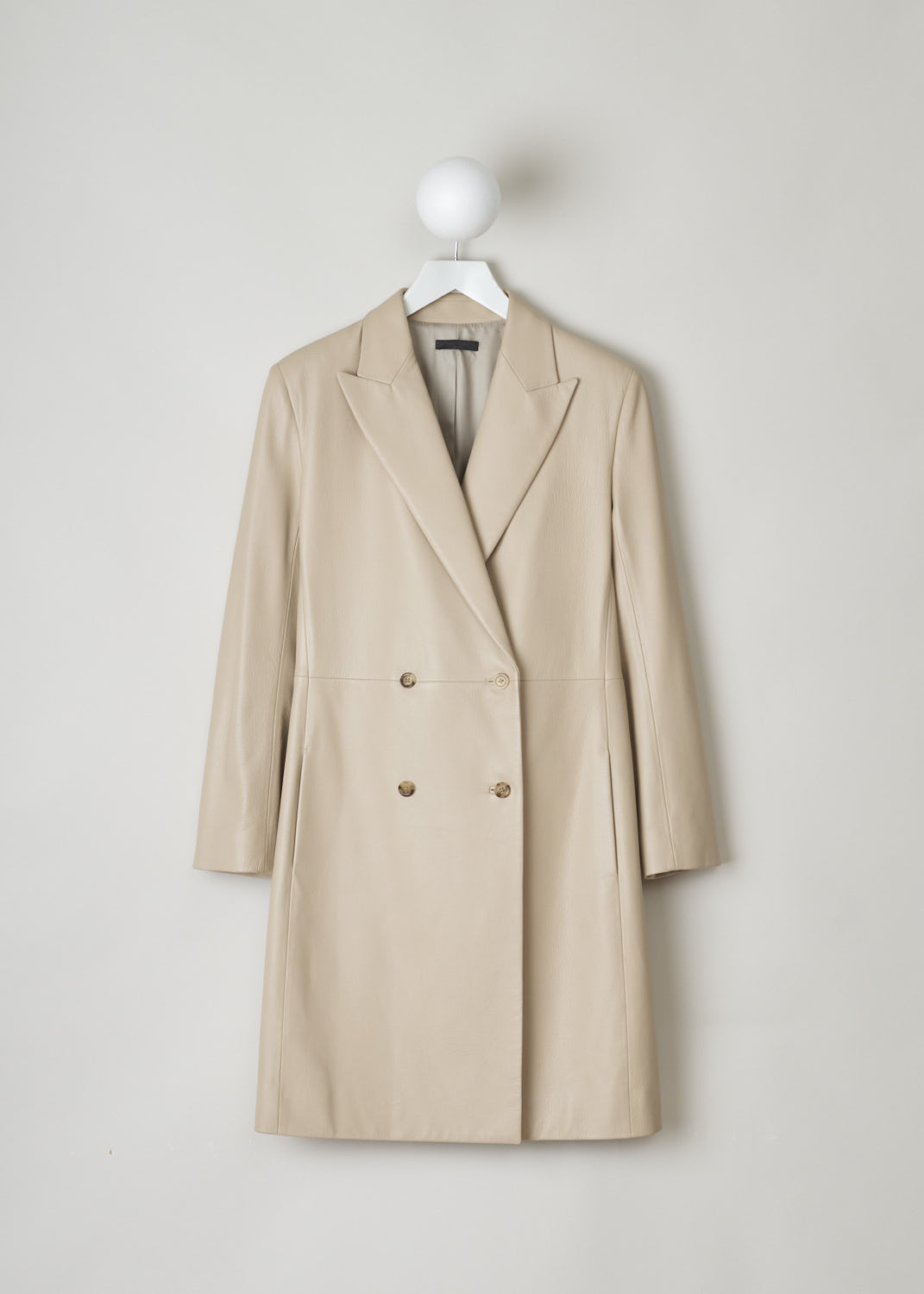 THE ROW, BEIGE LEATHER COAT, GERRICK_I_6I_8L79_SOAPSTONE, Beige, Front, This beautiful double breasted coat has peaked lapels. A decorative, horizontal seam can be found across the front. The coat has two concealed slanted pockets on either side. 
